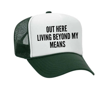 OUT HERE LIVING BEYOND MY MEANS TRUCKER HAT